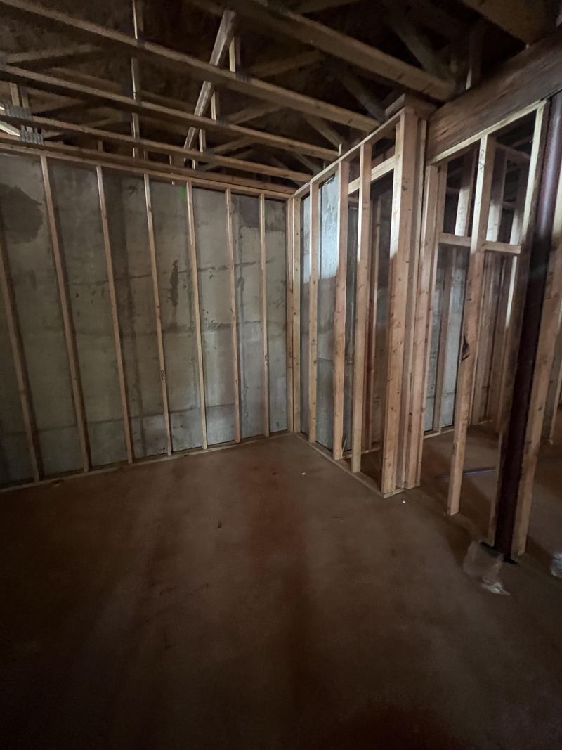 Example build style: framed simulator room under construction showing ceiling height and open joists ready for blocking and conduit